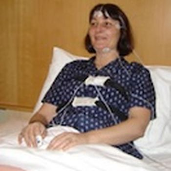 A magnet on the chest to monitor its rise and fall.